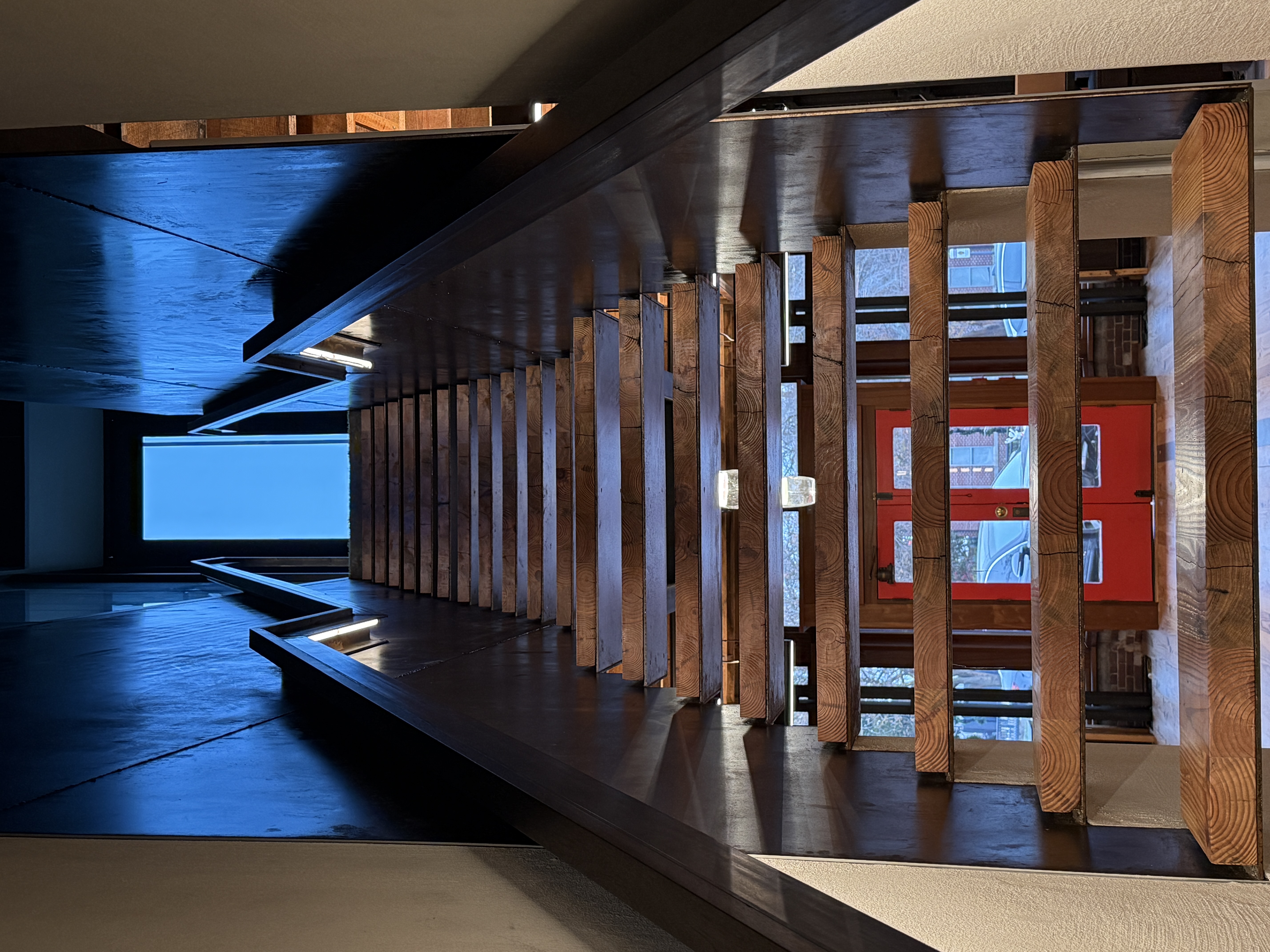 Custom steel staircase with wood treads and LED lighting